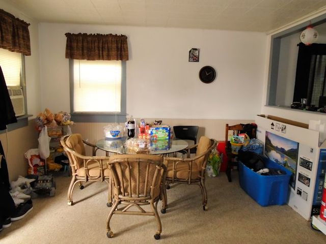 609 North 3rd Street Rochelle, IL 61068 - Photo 11 of 15 a view of a workspace with furniture and a flat screen tv