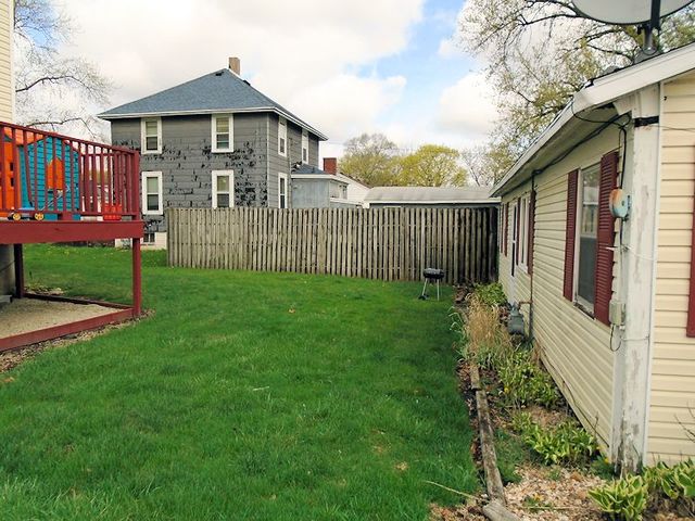 609 North 3rd Street Rochelle, IL 61068 - Photo 14 of 15 a front view of a house with yard and green space