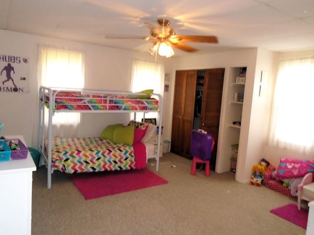 609 North 3rd Street Rochelle, IL 61068 - Photo 5 of 15 a bedroom with bed and a baby crib