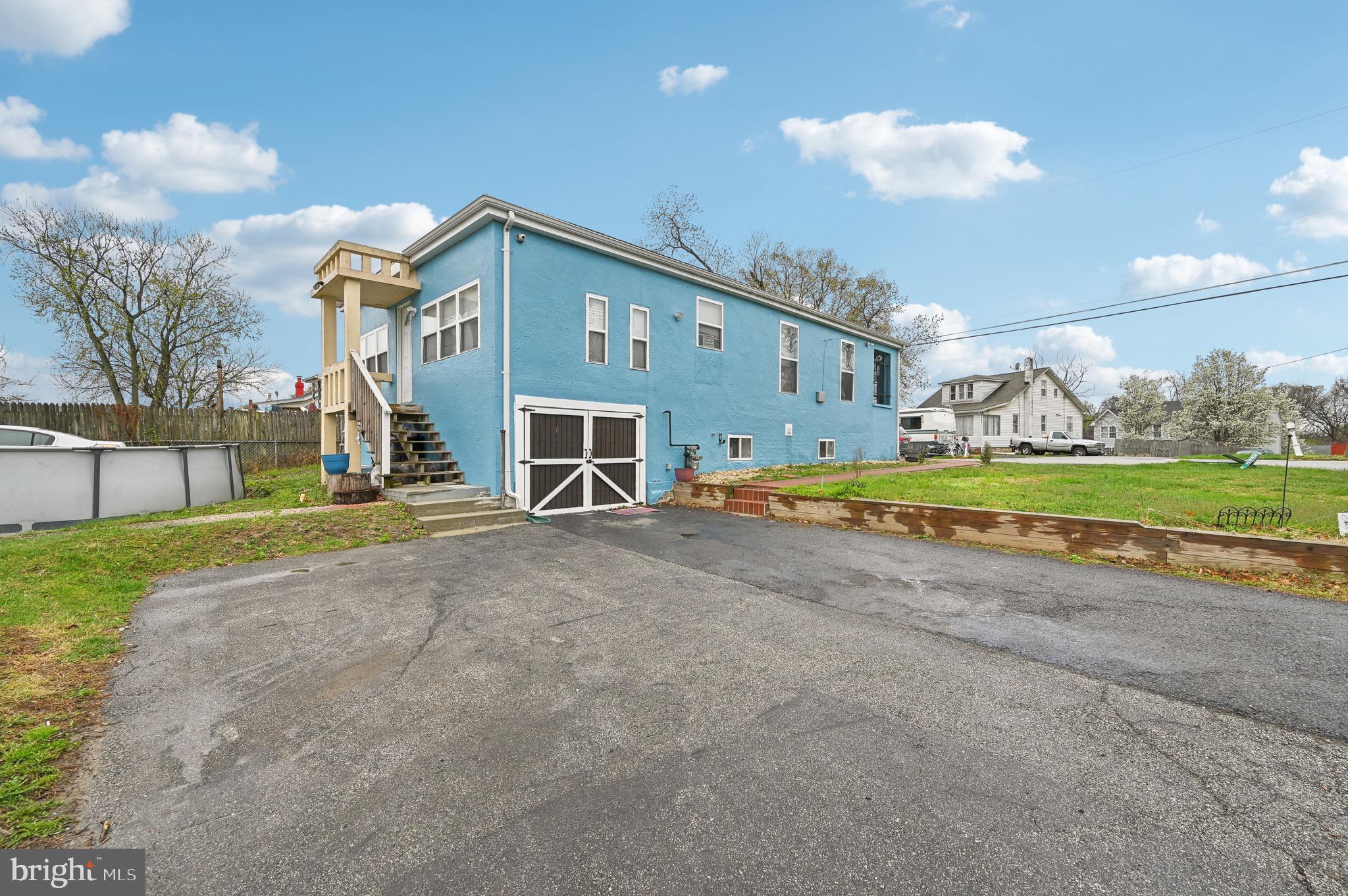 a view of a house with a yard and garage