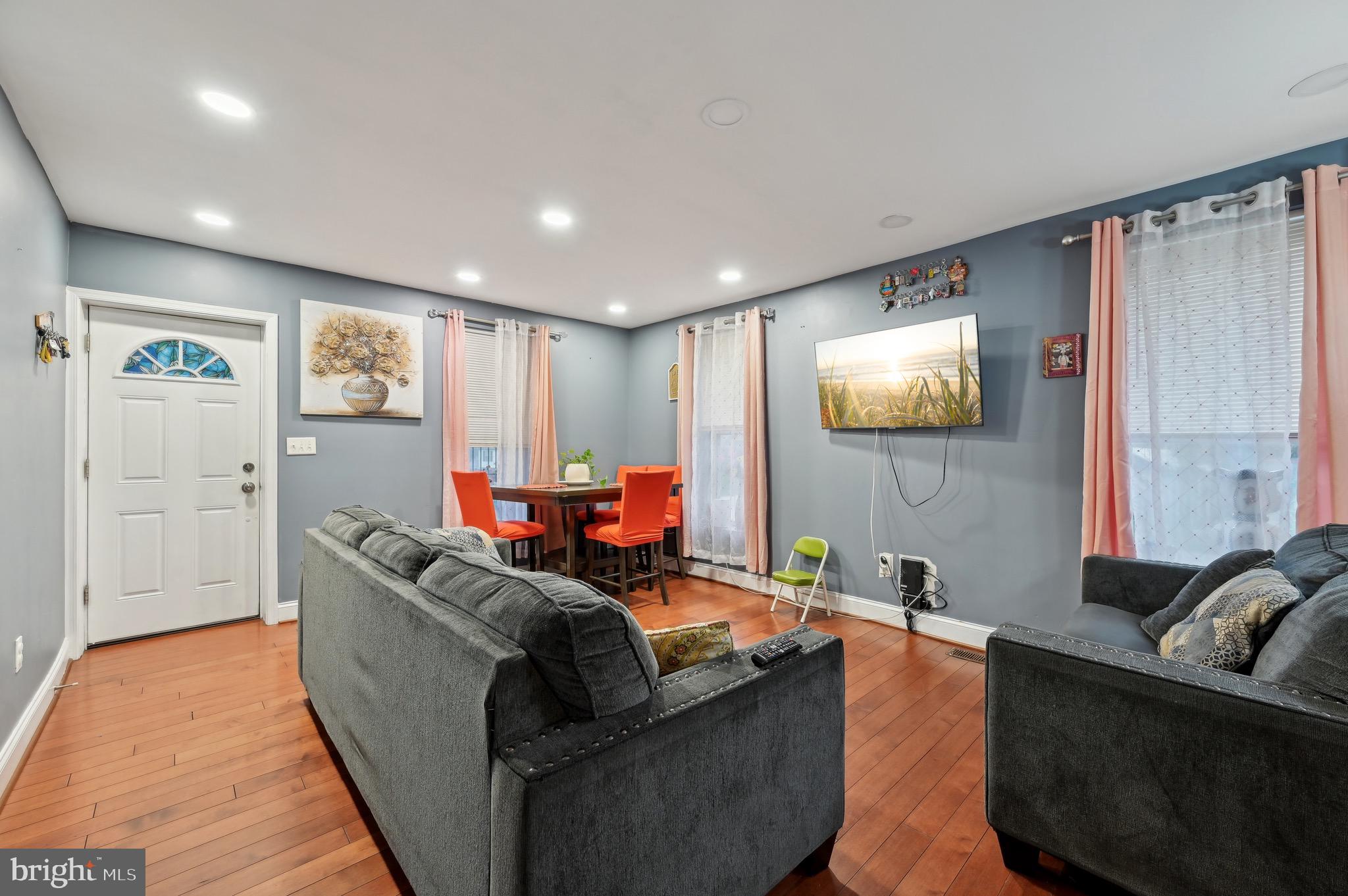 4101 Oak Road Baltimore, MD 21227 - Photo 7 of 25 a living room with furniture and a flat screen tv
