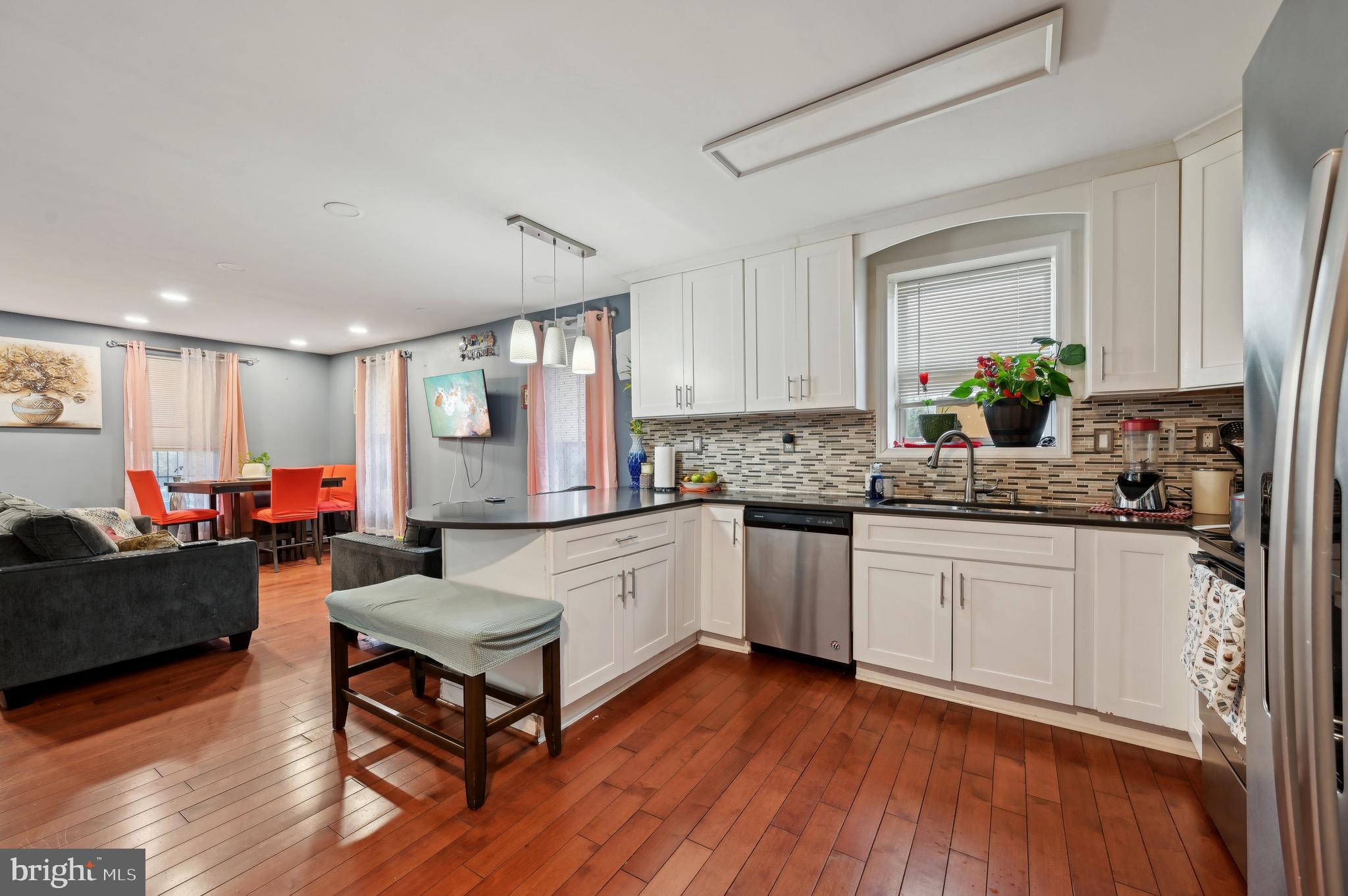 4101 Oak Road Baltimore, MD 21227 - Photo 10 of 25 a kitchen with a refrigerator and a stove top oven