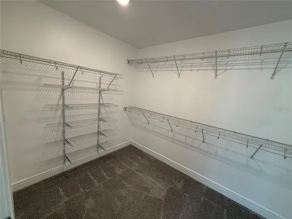 a view of a room with racks on the wall