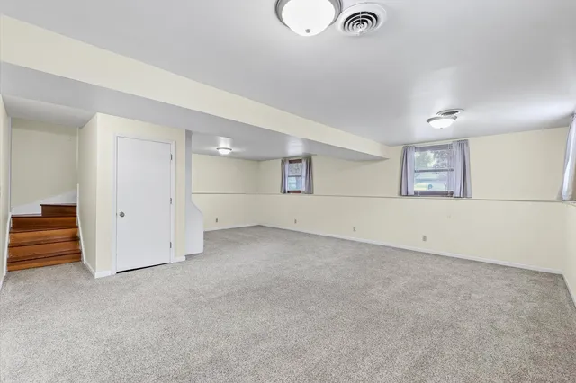 an empty room with a empty space and window