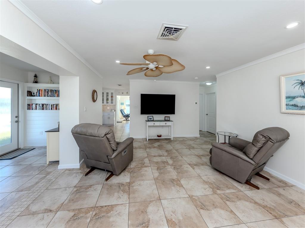 1977 Beach Road, Unit 83 Englewood, FL 34223 - Photo 11 of 48 a living room with furniture and a flat screen tv