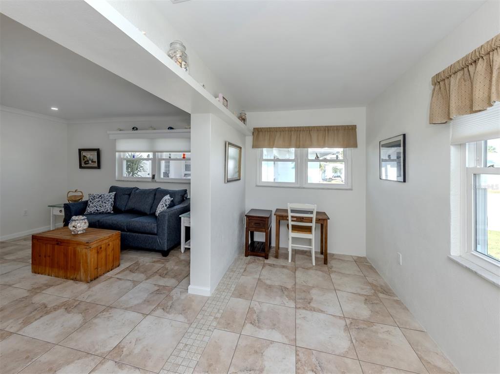 1977 Beach Road, Unit 83 Englewood, FL 34223 - Photo 14 of 48 a living room with furniture and a window