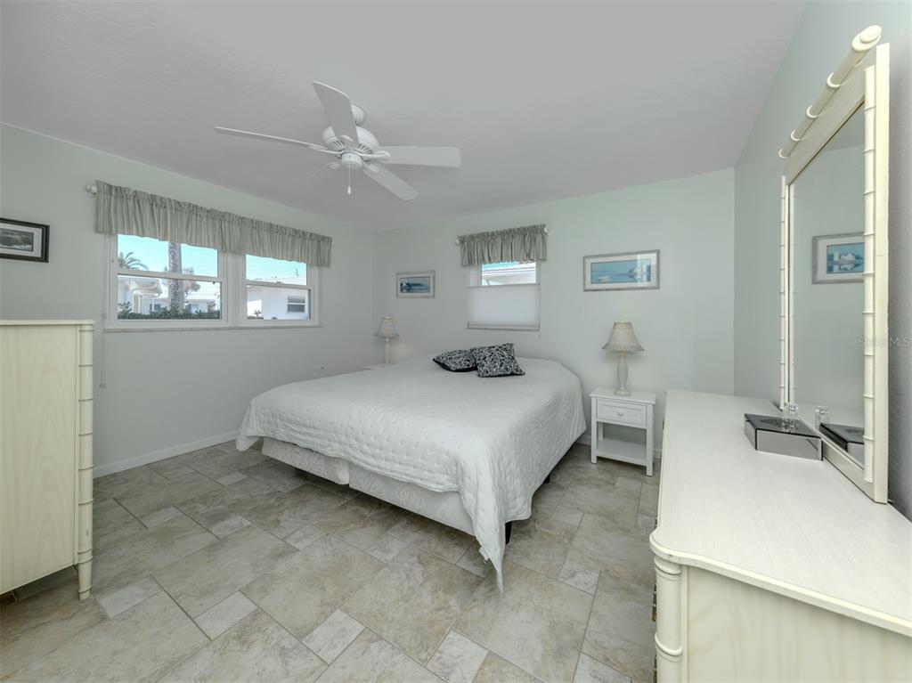 1977 Beach Road, Unit 83 Englewood, FL 34223 - Photo 17 of 48 a bedroom with a bed and window