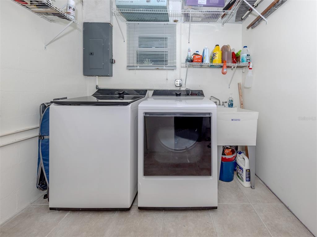 1977 Beach Road, Unit 83 Englewood, FL 34223 - Photo 22 of 48 a utility room with dryer and washer