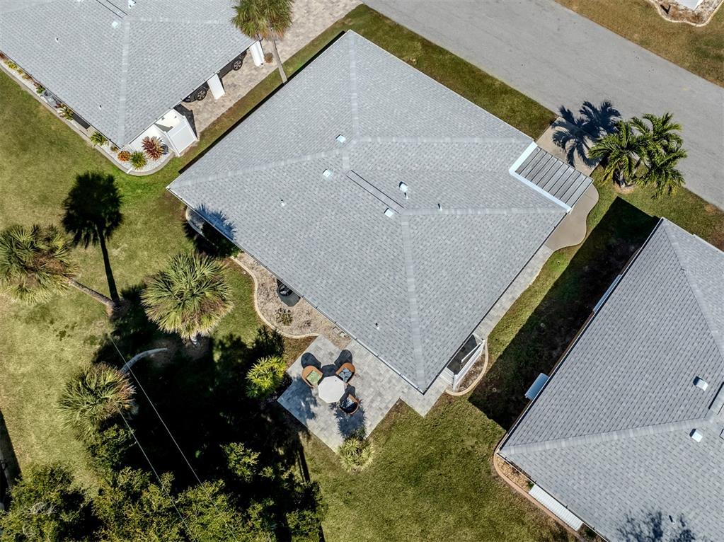 1977 Beach Road, Unit 83 Englewood, FL 34223 - Photo 27 of 48 a picture of flowers in front of a house