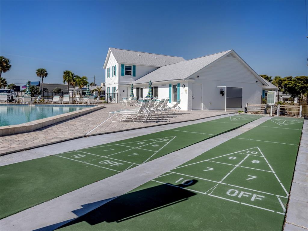 1977 Beach Road, Unit 83 Englewood, FL 34223 - Photo 31 of 48 a view of a house with a backyard