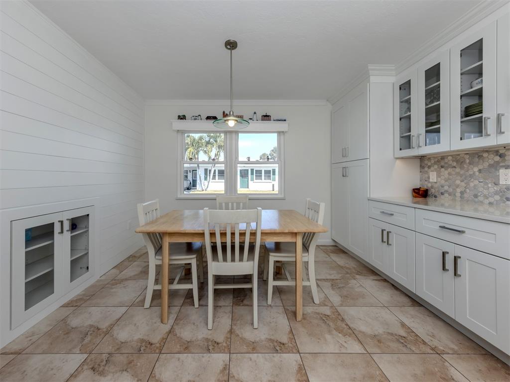1977 Beach Road, Unit 83 Englewood, FL 34223 - Photo 6 of 48 a dining room with furniture and window