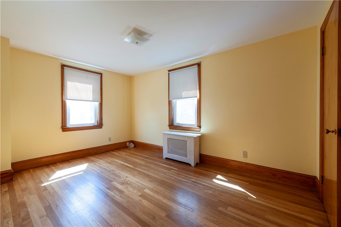 27 Eaton Street Pawtucket, RI 02861 - Photo 9 of 27 Bedroom with hardwood floor is a good size.