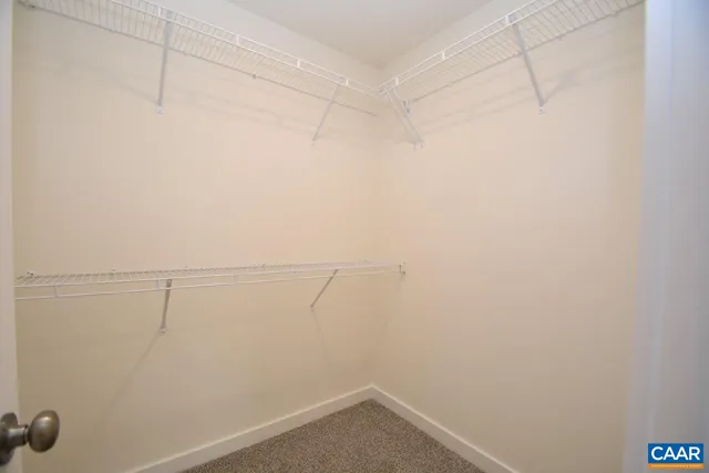 a view of a room with racks on the wall