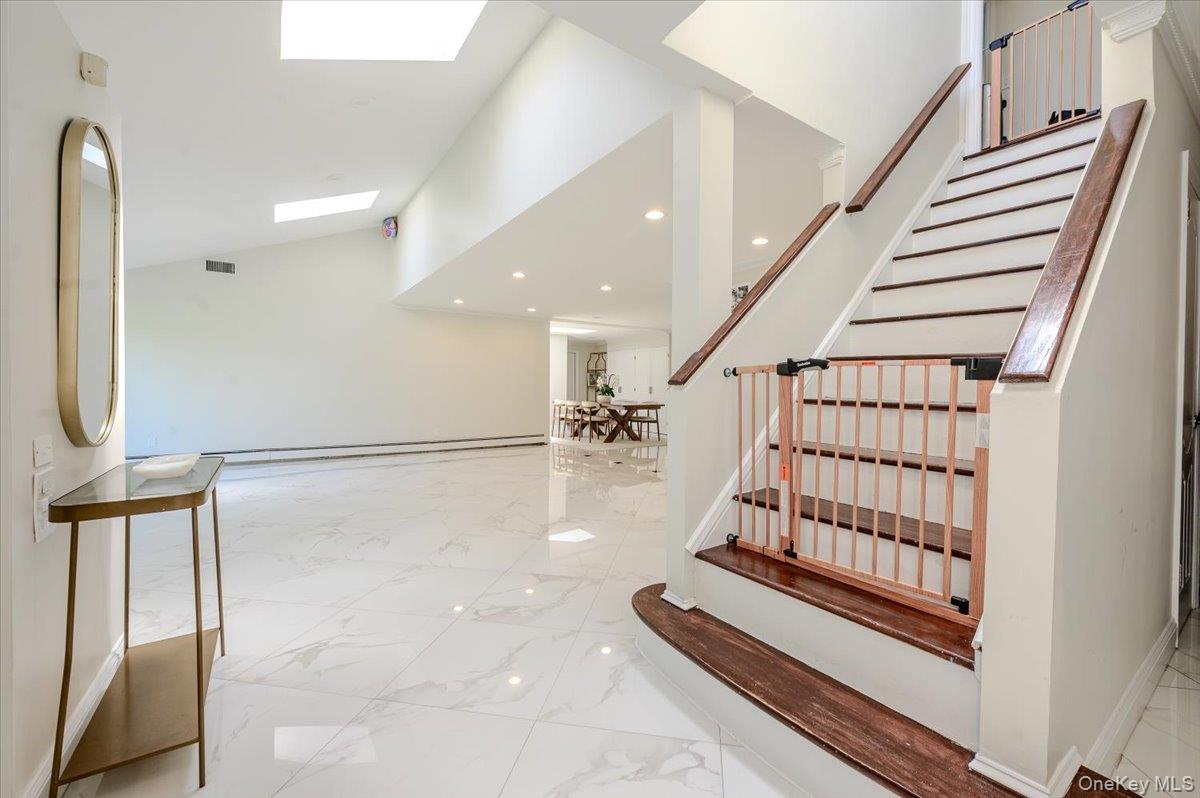 70 Longfellow Road Great Neck, NY 11023 - Photo 6 of 28 a view of entryway with stairs and wooden floor