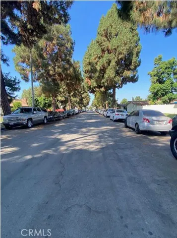 a view of street with parked cars