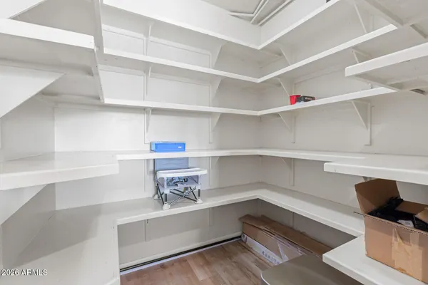 a bathroom with a sink toilet and a mirror