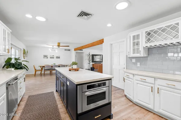 a kitchen with a stove and a refrigerator