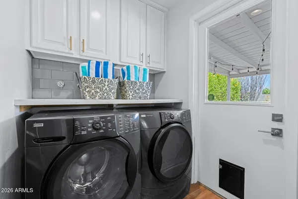 a utility room with dryer and washer