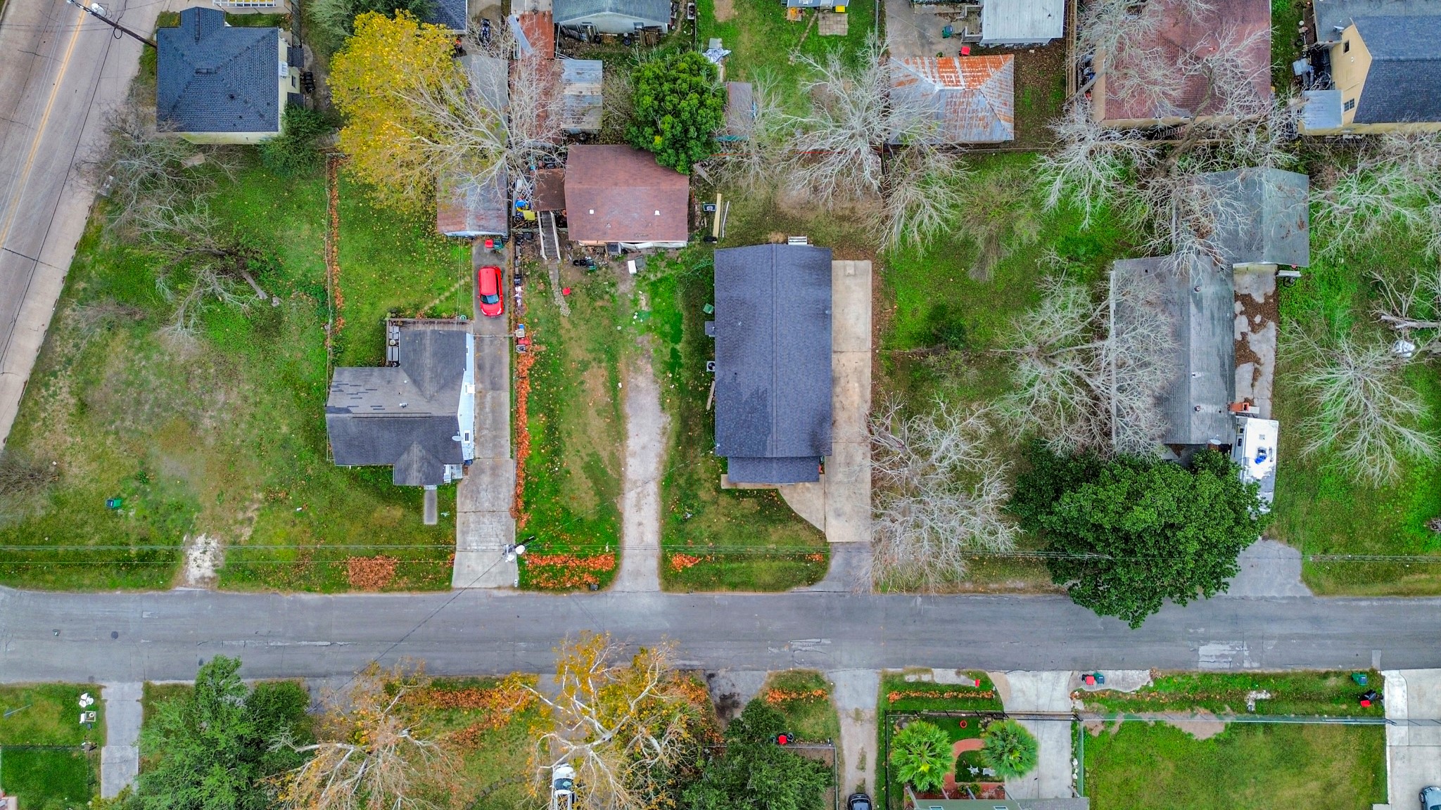 15 High Street Baytown, TX 77520 - Photo 3 of 29 an aerial view of a house with a garden and yard