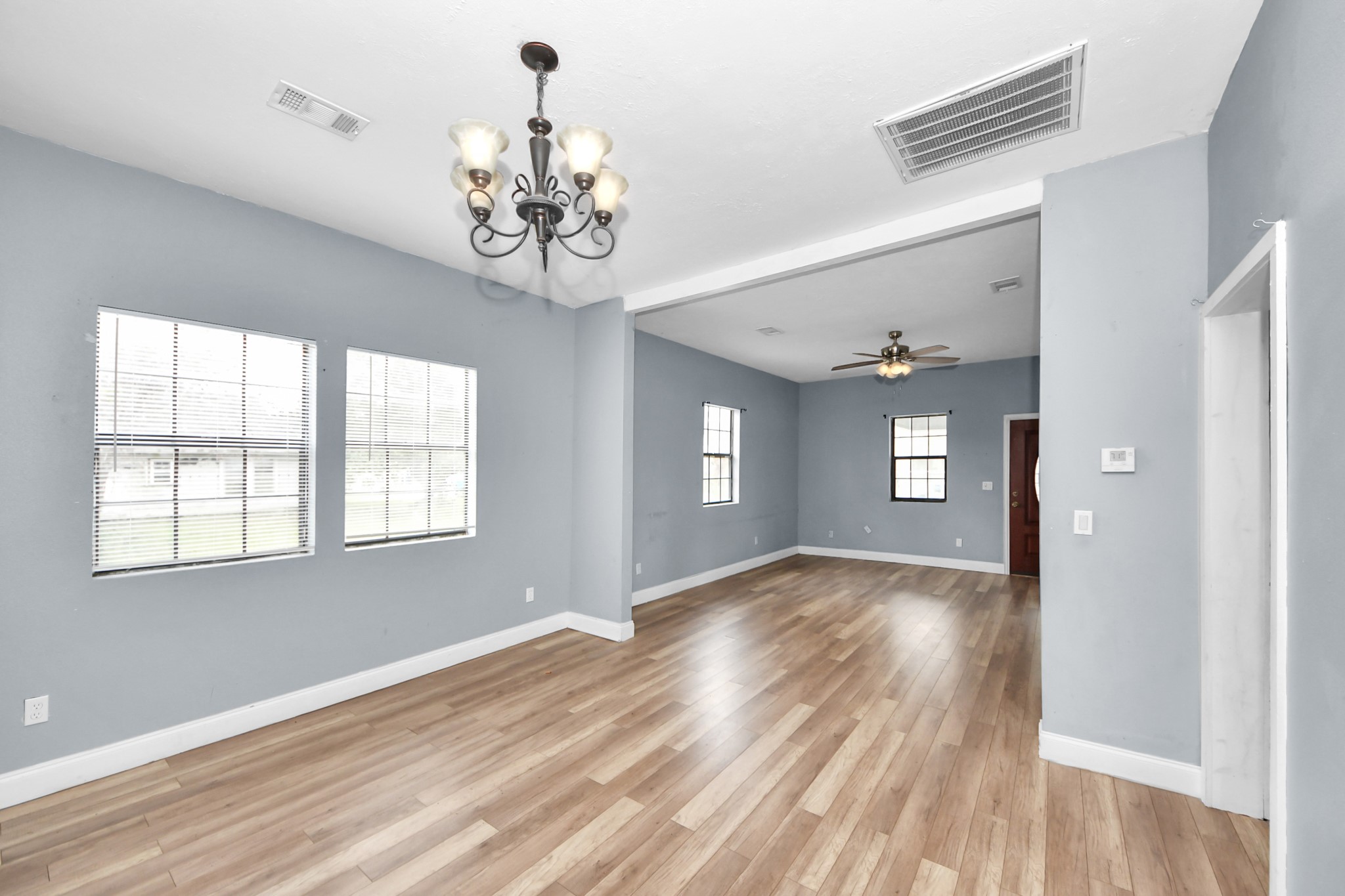 15 High Street Baytown, TX 77520 - Photo 6 of 29 wooden floor in an empty room with a window