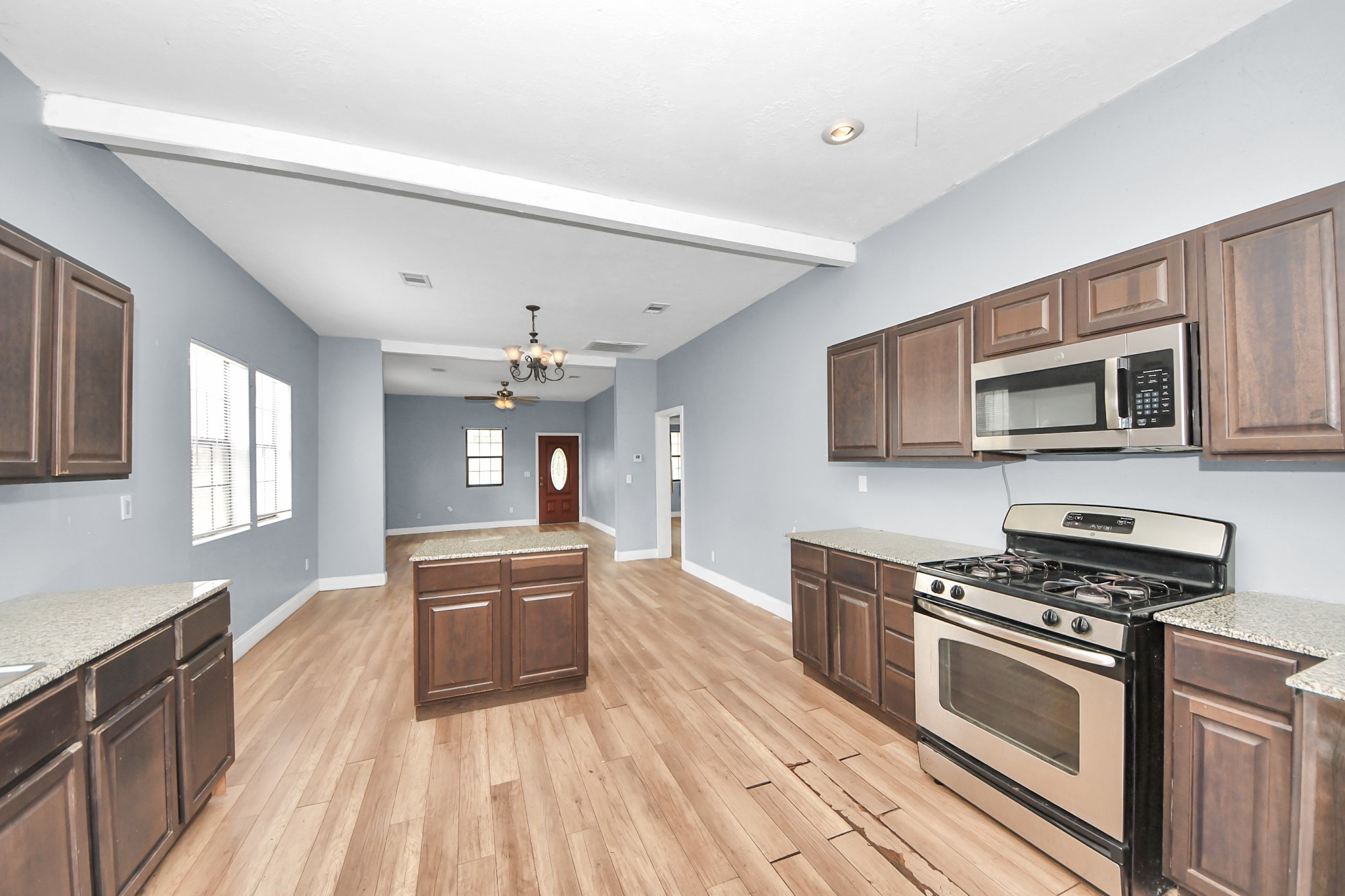 15 High Street Baytown, TX 77520 - Photo 9 of 29 a large kitchen with stainless steel appliances granite countertop a stove and a sink