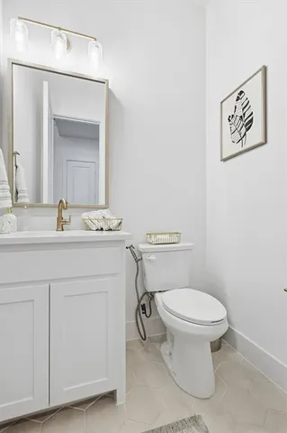 a spacious bedroom with a bed and a window