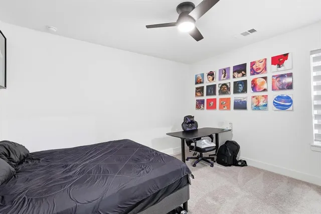 a bathroom with a sink a toilet a mirror and shower curtain