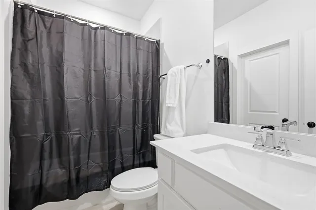 a bedroom with a workspace