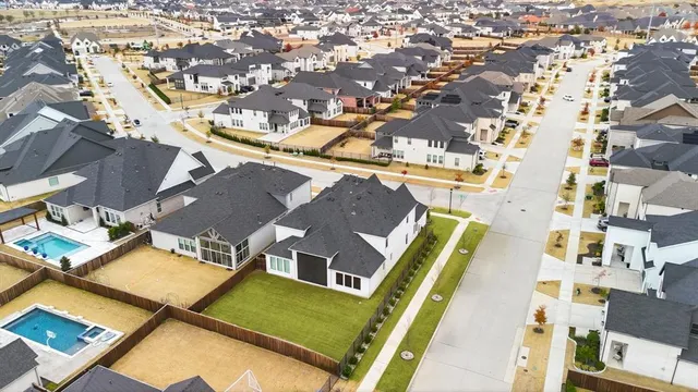 an aerial view of a city with lots of residential buildings