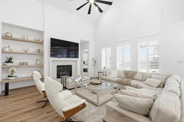 a living room with furniture fireplace and a flat screen tv