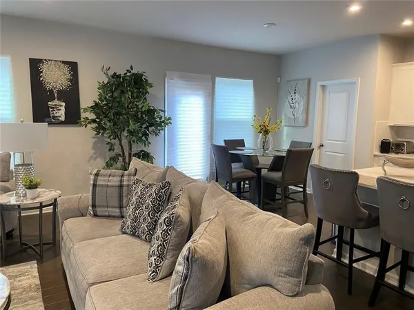 an empty room with wooden floor and fireplace