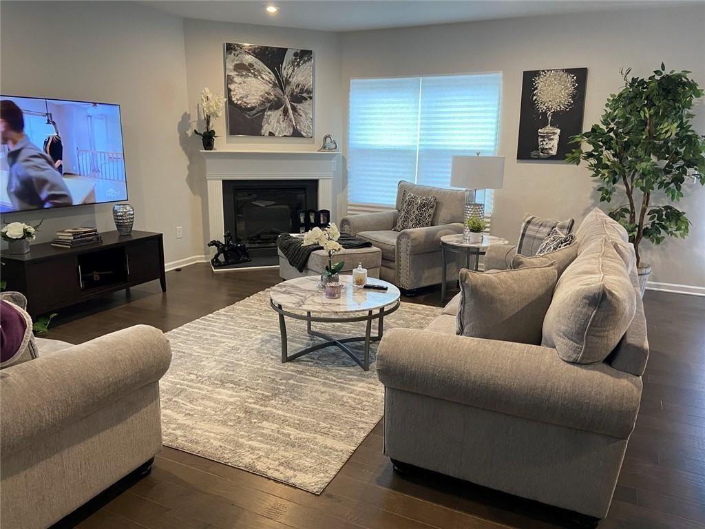 230 Mackenzie Court Covington, GA 30016 - Photo 14 of 23 a living room with furniture and a fireplace
