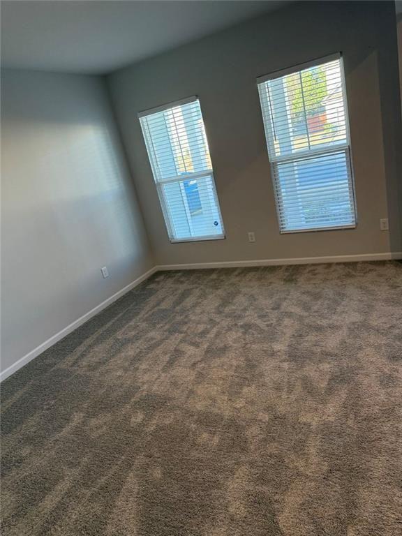 230 Mackenzie Court Covington, GA 30016 - Photo 5 of 23 an empty room with windows