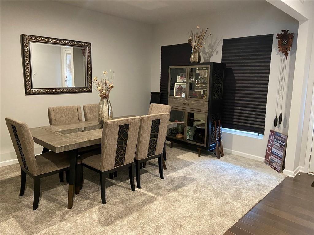 230 Mackenzie Court Covington, GA 30016 - Photo 6 of 23 a dining room with furniture and window