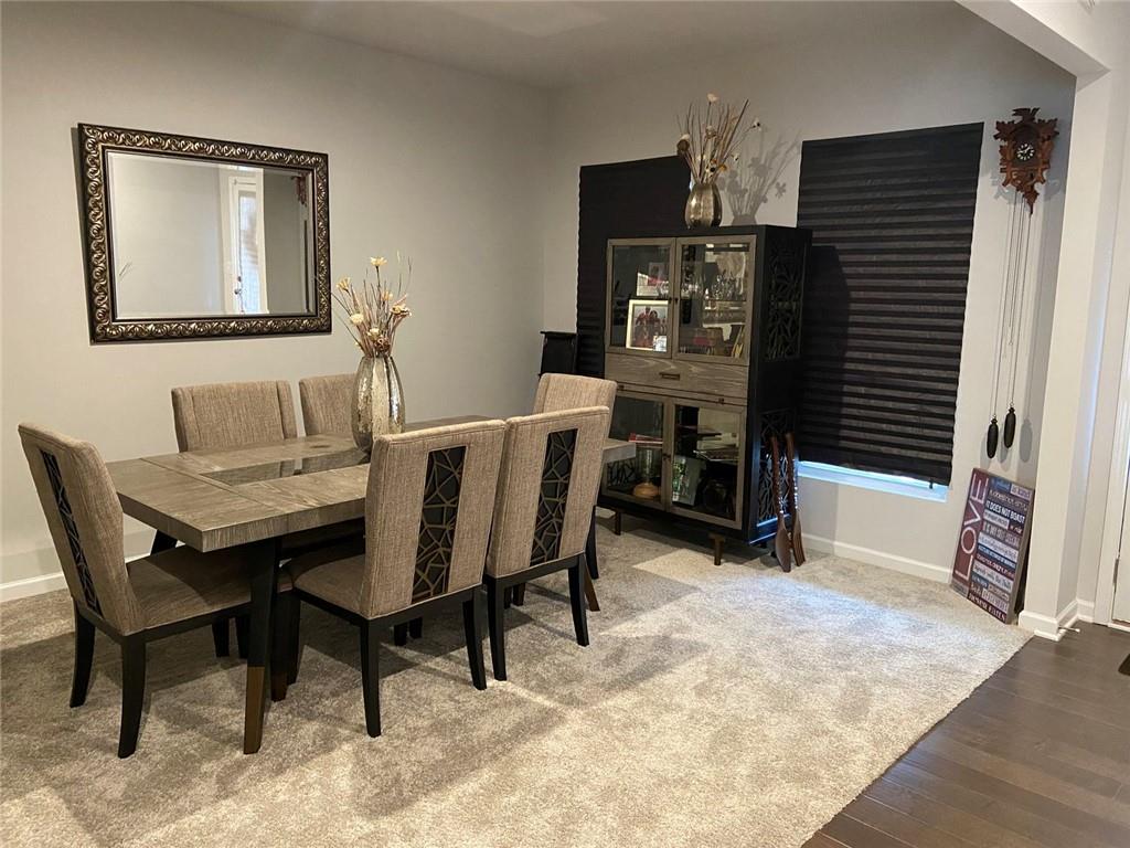 230 Mackenzie Court Covington, GA 30016 - Photo 6 of 23 a dining room with furniture and window