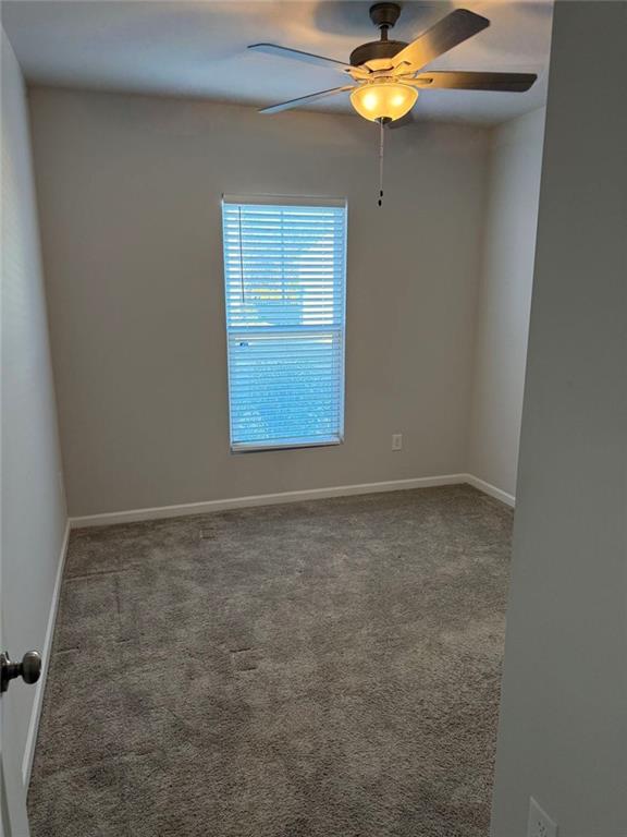 230 Mackenzie Court Covington, GA 30016 - Photo 7 of 23 an empty room with a window