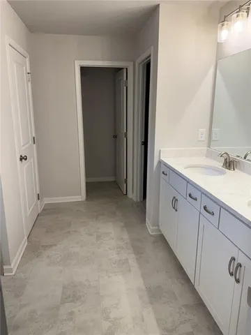 a view of a bathroom with mirror