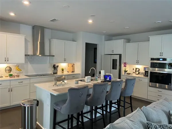 a view of a dining room with furniture and wooden floor