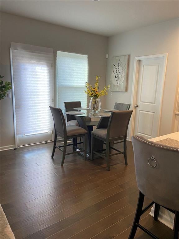 230 Mackenzie Court Covington, GA 30016 - Photo 10 of 23 a view of a dining room with furniture and wooden floor