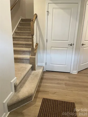 a view of staircase with white walls