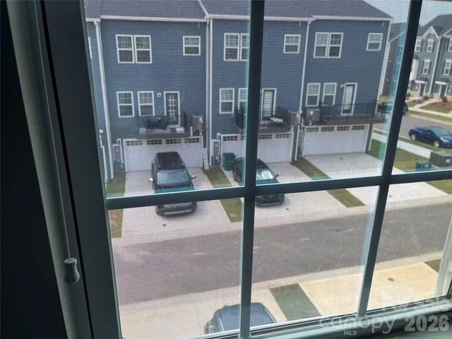 a view of a balcony with chairs