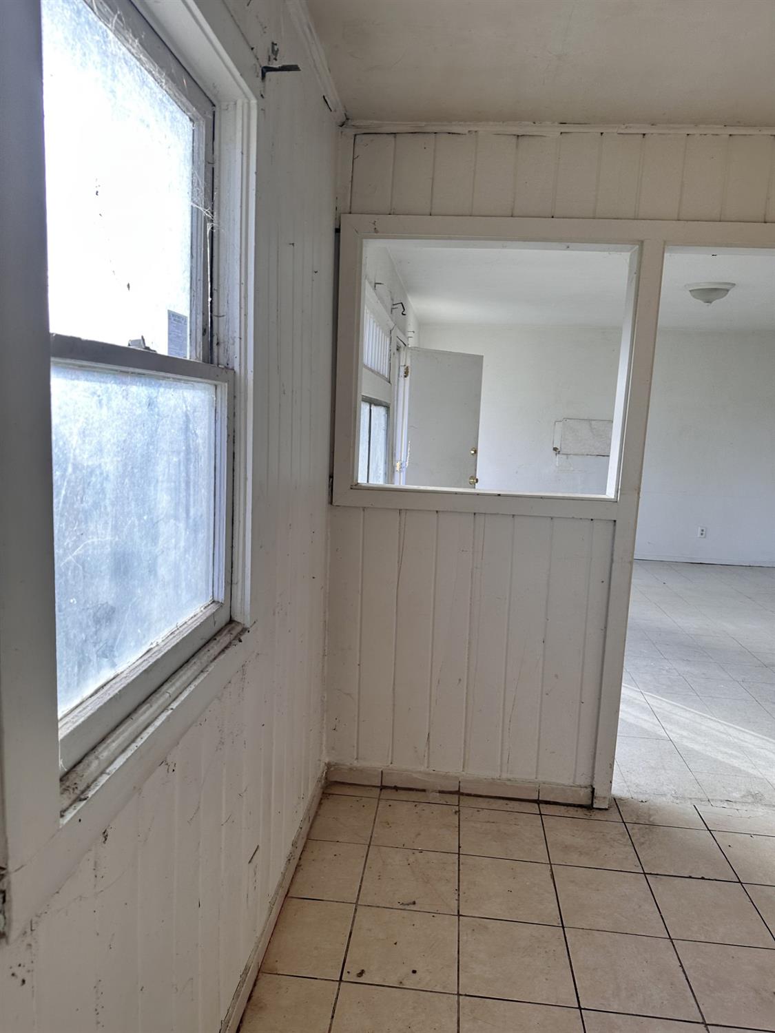 864 East Evening Glow Avenue Reedley, CA 93654 - Photo 14 of 18 a view of a kitchen cabinets and a refrigerator
