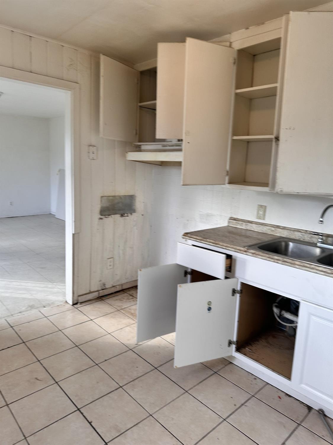 864 East Evening Glow Avenue Reedley, CA 93654 - Photo 15 of 18 a kitchen with cabinets and a stove top oven