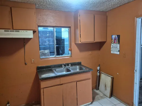 a kitchen with a sink and a cabinets