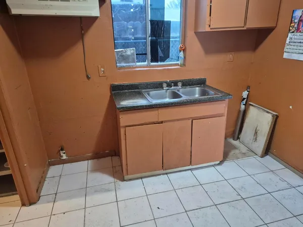 a kitchen with a cabinets and appliances