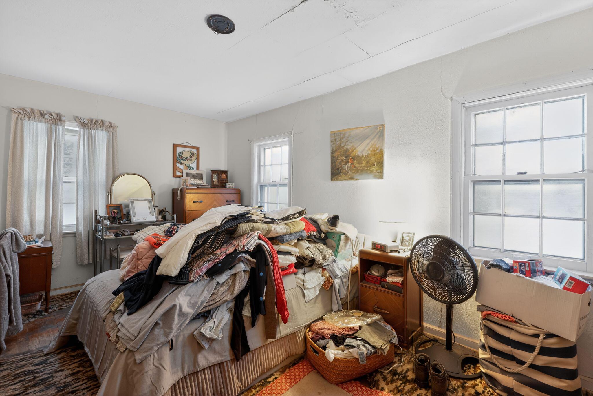 1027 Fox Street La Porte, IN 46350 - Photo 11 of 16 a bed room with a bed and a chair