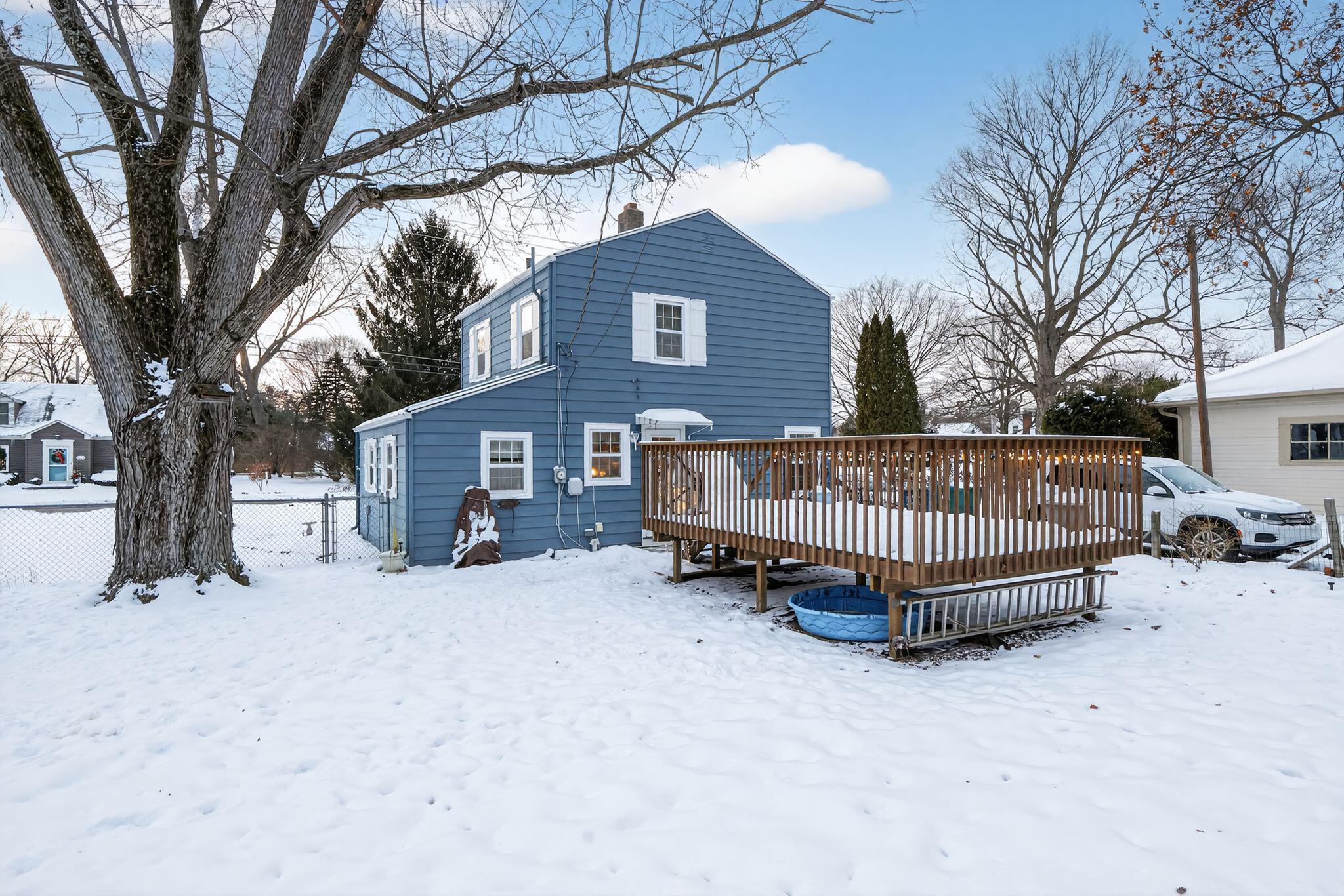 1027 Fox Street La Porte, IN 46350 - Photo 3 of 16 a view of a house with a yard covered in snow