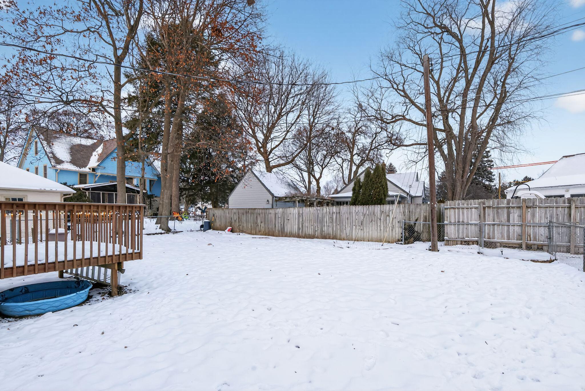 1027 Fox Street La Porte, IN 46350 - Photo 4 of 16 a street view covered with snow in front of house