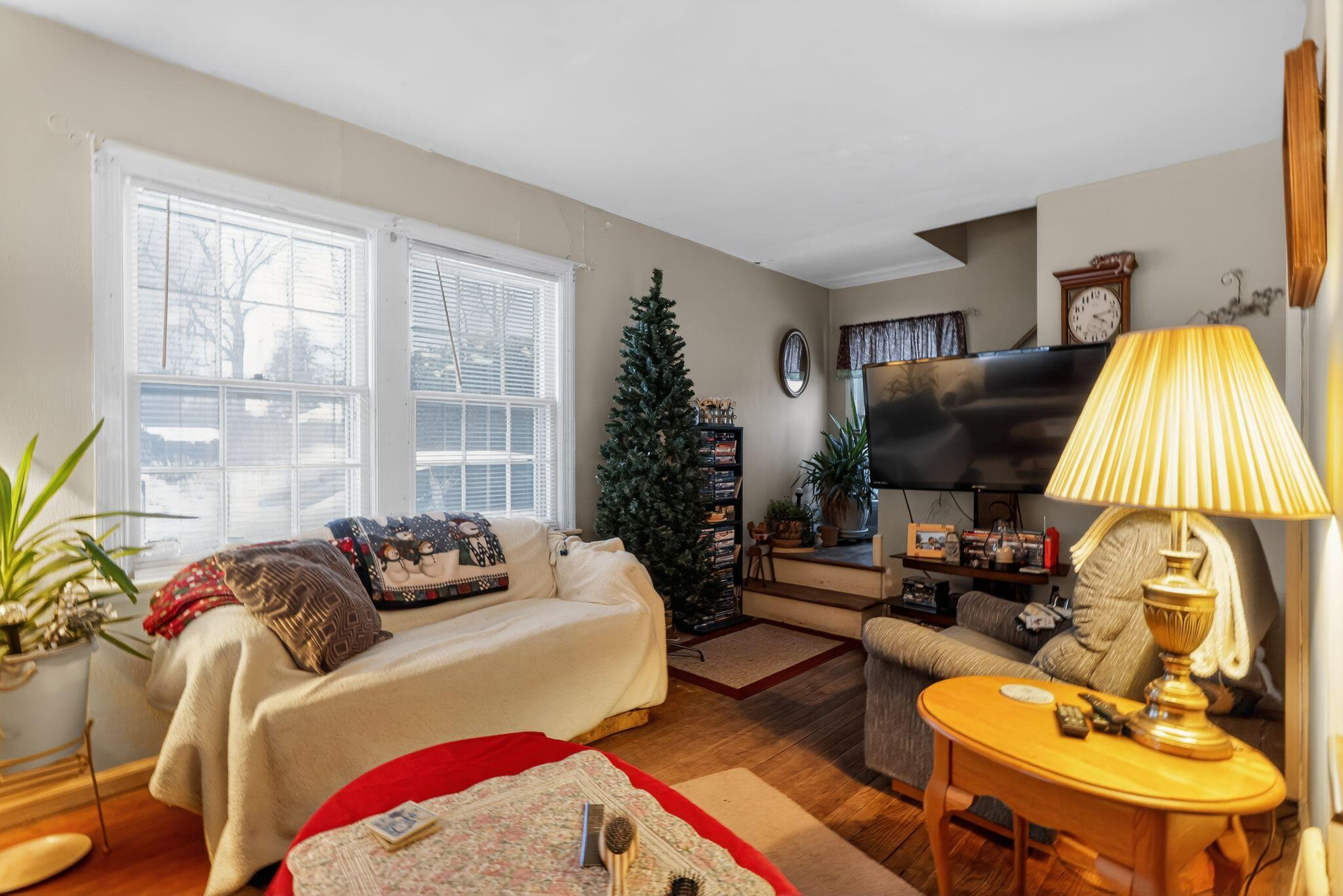 1027 Fox Street La Porte, IN 46350 - Photo 6 of 16 a living room with furniture and a flat screen tv