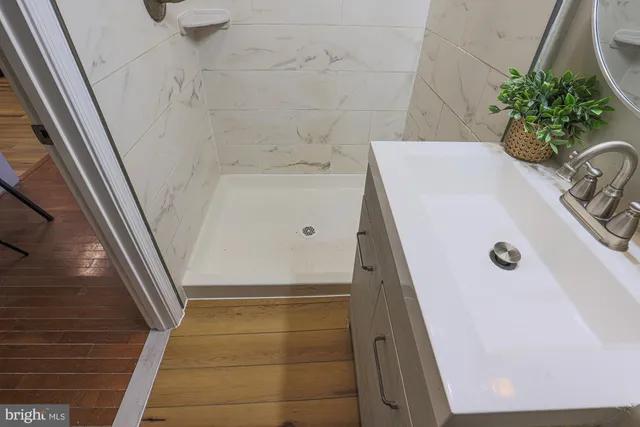 a bathroom with a sink and mirror